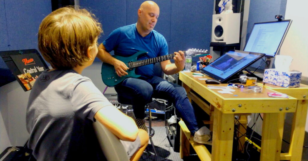 Dave Paris teaching guitar lessons at Wall of Sound Productions